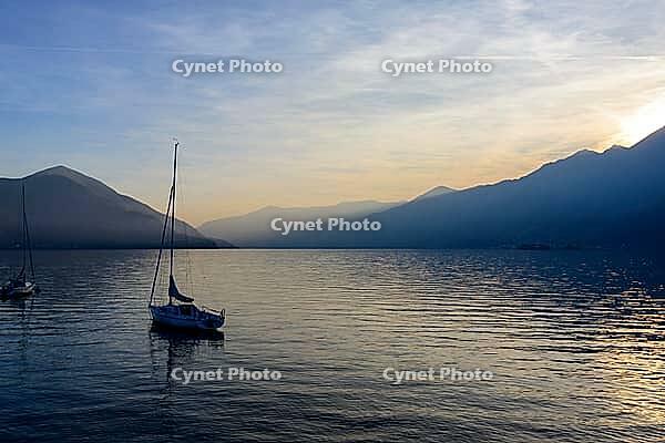 View of boats on the lake against sunset [IBR124915289]