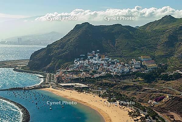 View from above of a beach with a village and mountains in the background near La Montanita in summer 2008 [IBR124915293]