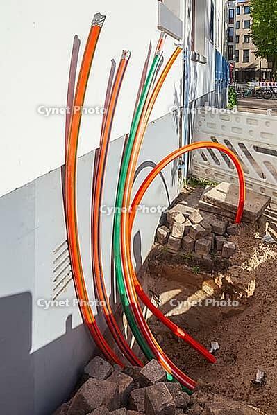 Construction site for laying fiber optic cables in front of a residential building, Bremen, Germany [IBR124920236]