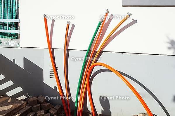 Construction site for laying fiber optic cables in front of a residential building, Bremen, Germany [IBR124920237]