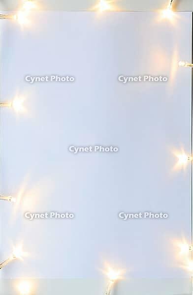 Christmas lights on gray table, view from above [IBR124944035]