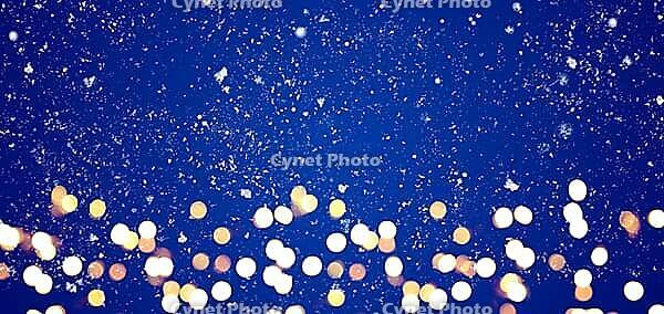 Blue festive Christmas or New Year background with shiny golden baubles [IBR124944038]