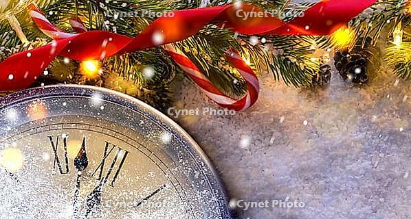 Countdown to midnight. Retro style clock counting last moments before Christmas or New Year 2017 next to decorated fir tree. View from above [IBR124944042]