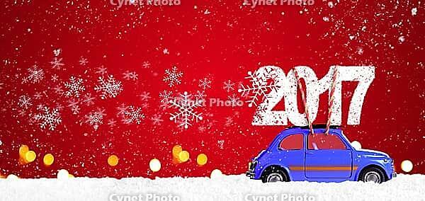 Blue retro toy car delivering Christmas or New Year 2017 on festive red background [IBR124944050]