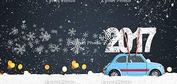 Blue retro toy car delivering Christmas or New Year 2017 on festive gray background [IBR124944060]