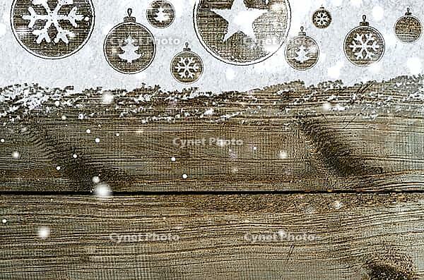 Christmas card or new year background made of xmas symbols handwritten on snow and wooden table [IBR124944085]