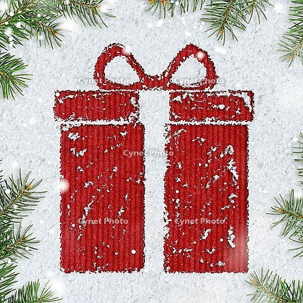 Christmas card or new year background made of gift box handwritten on snow and fir-tree branches over red craft paper [IBR124944088]
