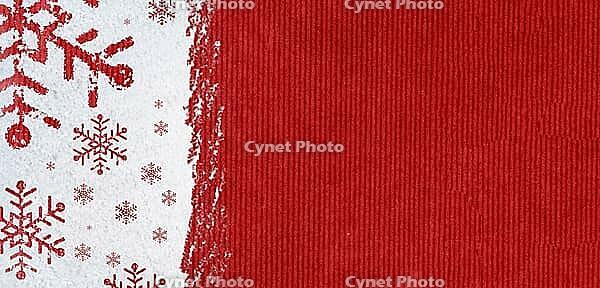Christmas card or new year background made of snowflakes symbols handwritten on snow and red craft paper [IBR124944091]