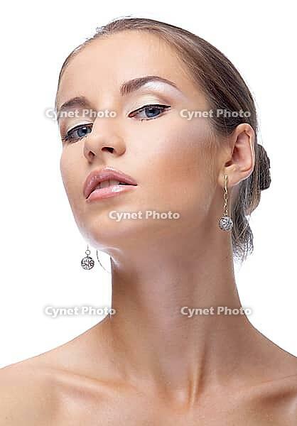 Close-up portrait of beautiful blue eyed caucasian model on white [IBR124968390]