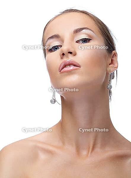 Close-up portrait of beautiful blue eyed caucasian model on white [IBR124968391]