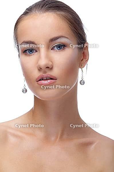 Close-up portrait of beautiful blue eyed caucasian model on white [IBR124968392]