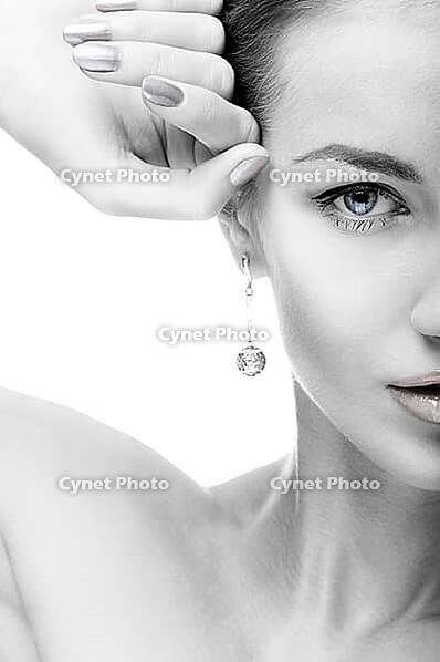 Close-up portrait of beautiful blue eyed caucasian model on white [IBR124968411]