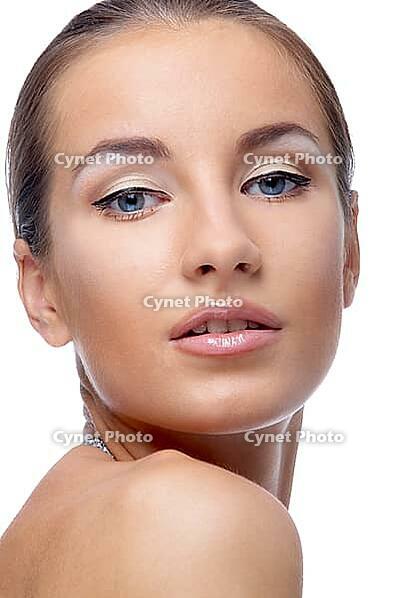 Close-up portrait of beautiful blue eyed caucasian model on white [IBR124968413]