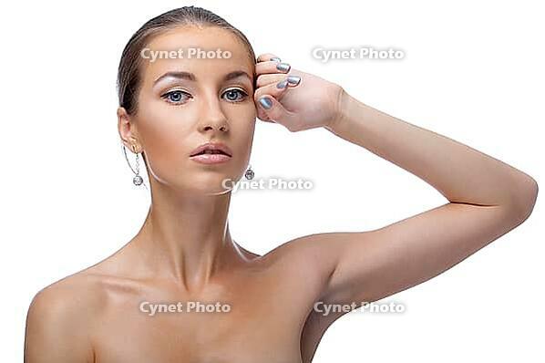 Close-up portrait of beautiful blue eyed caucasian model on white [IBR124968420]