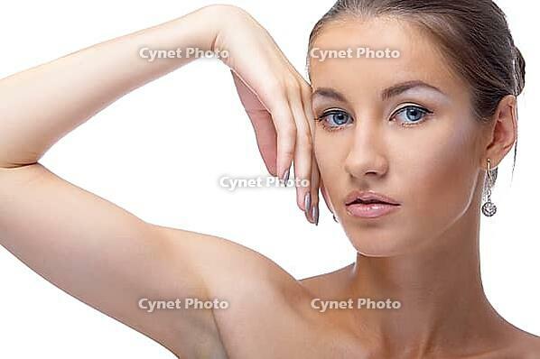 Close-up portrait of beautiful blue eyed caucasian model on white [IBR124968421]