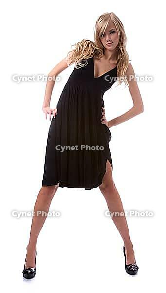 Portrait of beautiful blonde model poses in black dress [IBR124968424]