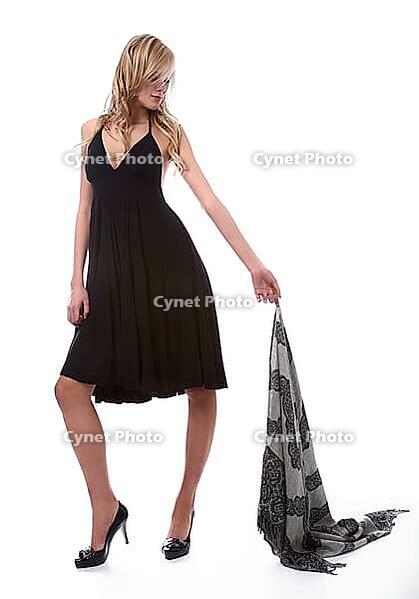 Portrait of beautiful blonde model poses in black dress with shawl [IBR124968426]
