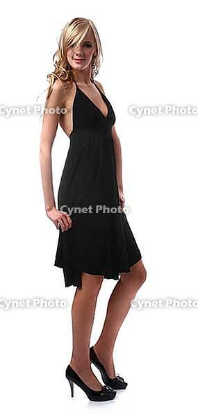 Portrait of beautiful blonde model poses in black dress [IBR124968430]