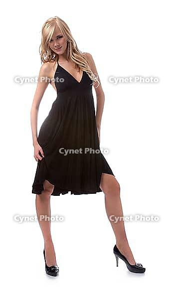 Portrait of beautiful blonde model poses in black dress [IBR124968434]
