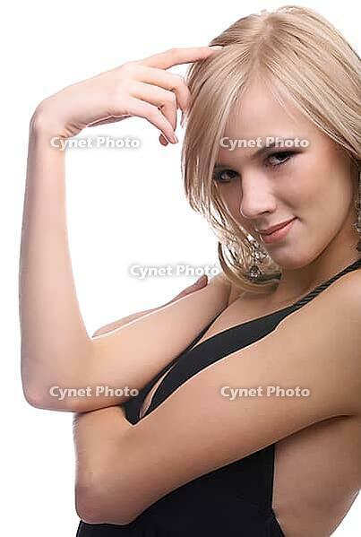 Close-up portrait of beautiful sensual blonde model poses looking over her shoulder and slightly touches her hair [IBR124968438]