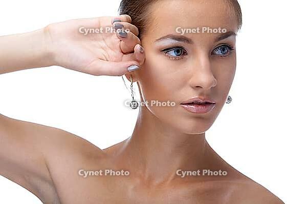 Close-up portrait of beautiful blue eyed caucasian model on white [IBR124968444]