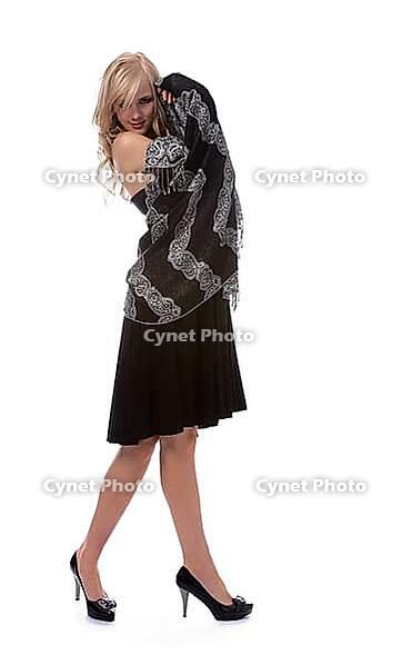 Portrait of beautiful blonde model poses in black dress with shawl [IBR124968447]