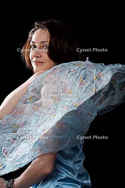 Woman in blue peignoir isolated on the black background [IBR124968453]