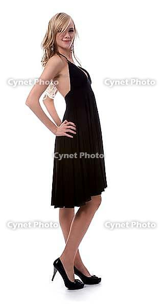 Portrait of beautiful blonde model poses in black dress [IBR124968456]