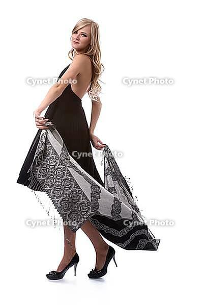 Portrait of beautiful blonde model poses in black dress with shawl [IBR124968460]