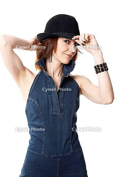 Young woman with hat isolated on the black background [IBR124968462]