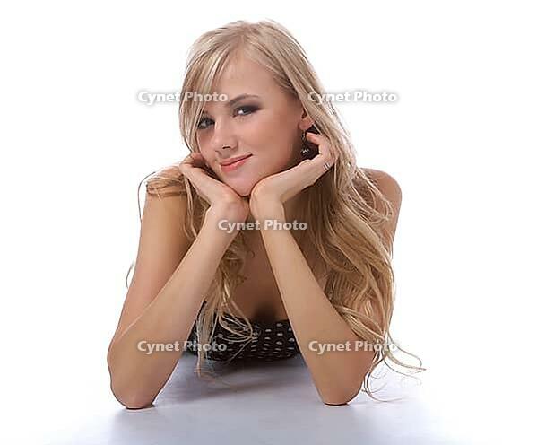 Portrait of beautiful blonde model lays in polka-dot body [IBR124968481]