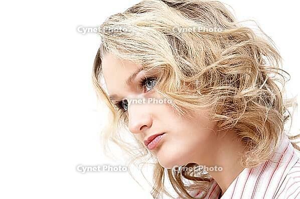 Portrait of blonde girl in pink dress on white background [IBR124968485]