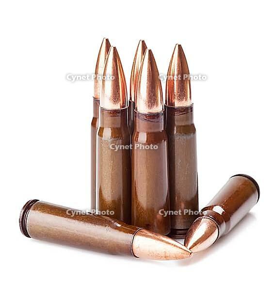 Scratched ammunition for AK-47 on a white background [IBR124991083]