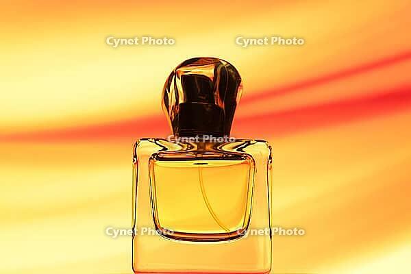 Bottle with parfumom on a beautiful backdrop [IBR124991126]