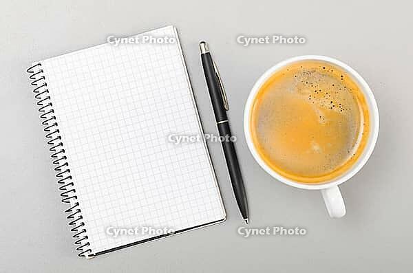 Creative process. blank notebook and cup on gray [IBR125000239]