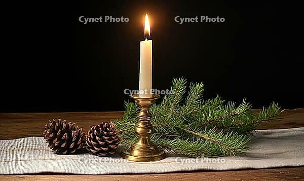 Simple tabletop setup with a brass candlestick and a single white candle, surrounded by small green pinecones. AI generated [IBR125000274]