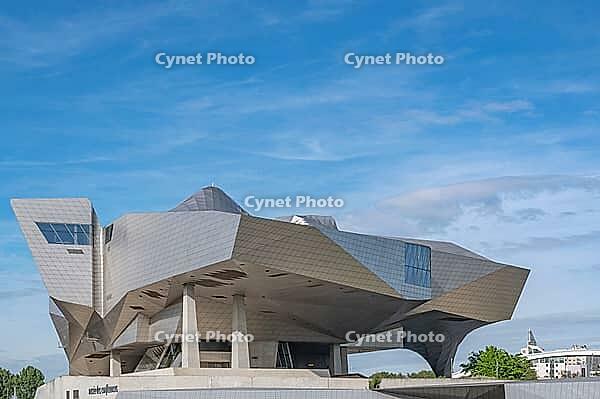 A spectacular close-up of the deconstructivist Musée des Confluences, designed by the Viennese architectural firm Coop Himmelb (l) au, featuring monumental cantilevers, asymmetrical angles and a gleaming stainless steel façade, an architectural landmark o [IBR125002333]
