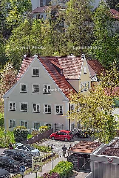 Pointed gable house in spring with blooming cherry tree, Kempten, Allgäu, Bavaria, Germany [IBR125002348]