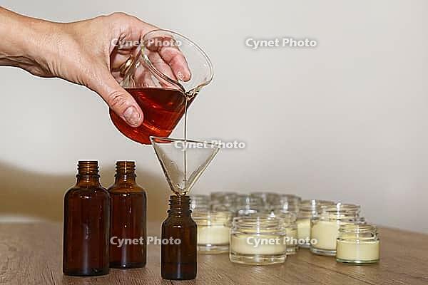 Homemade skincare oil Johanneskraut is bottled, Kempen, Viersen District, North Rhine-Westphalia, Germany [IBR125007623]