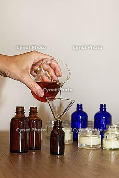 Homemade skincare oil Johanneskraut is bottled, Kempen, Viersen District, North Rhine-Westphalia, Germany [IBR125007624]