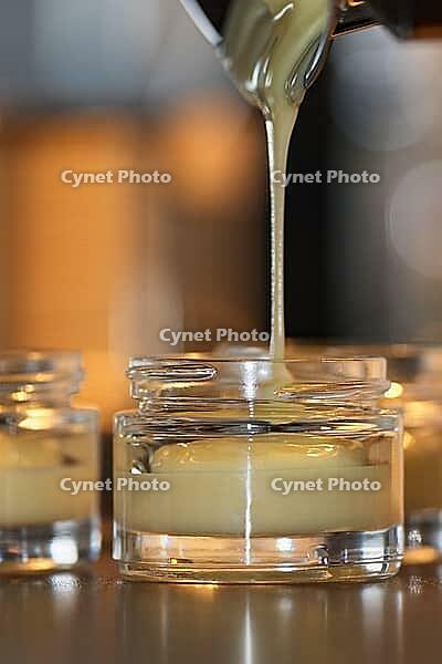 Homemade cream is filled into small jars, Kempen, Viersen district, North Rhine-Westphalia, Germany [IBR125007631]