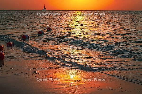 Sunset at sea with the coast in and safety buoy view. a beautiful nature landscape for safety and tranquil peace of mind themes and concepts [IBR125026142]