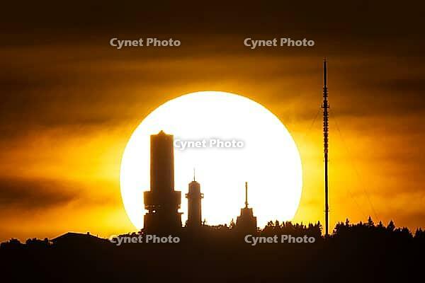 Seen from Frankfurt am Main, the sun sets behind the Großer Feldberg in the Taunus, Taunus, Schmitten, Hesse, Germany [IBR125026184]