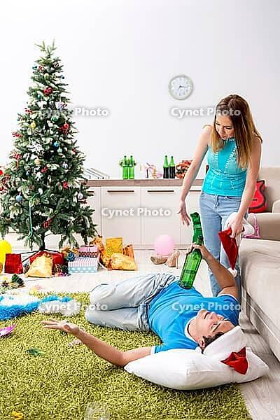 Young family celebrating christmas at home [IBR125053237]