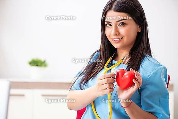 Young beautiful female doctor working in the clinic [IBR125053241]