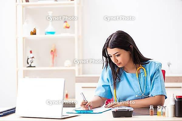 Young beautiful female doctor working in the clinic [IBR125053252]
