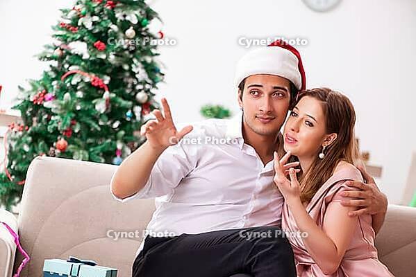 Man making marriage proposal at christmas day [IBR125053254]