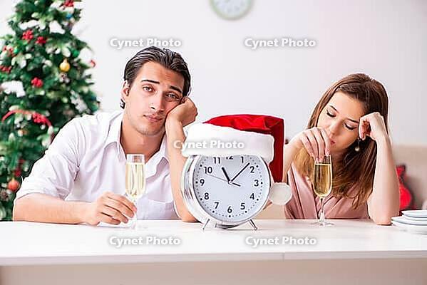 Young couple celebrating christmas at home [IBR125053259]