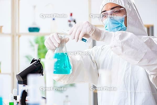 Young chemist student working in lab on chemicals [IBR125062168]