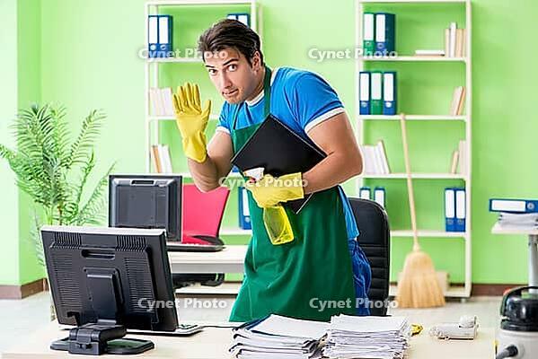 Male spy under cleaner cover stealing confidential documents [IBR125062184]